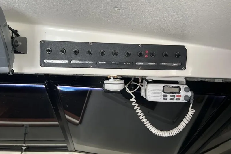 Slide: The Image of Control panel and radio on a 1978 Silverton F32 boat. - 18