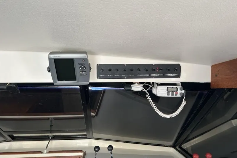 Slide: The Image of 1978 Silverton F32 boat dashboard with navigation equipment and control panel. - 20