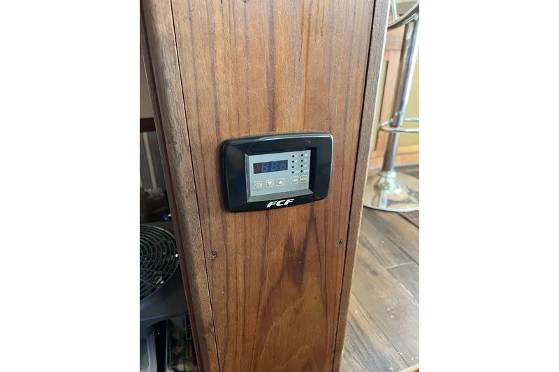 Slide: The Image of Digital control panel on 1978 Silverton F32 boat's wooden interior. - 21