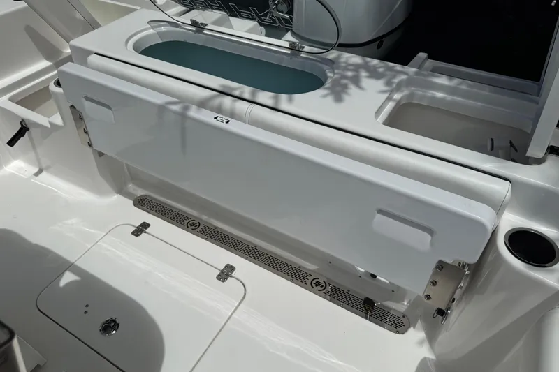 Slide: The Image of 2022 Sea Pro 219 Center Console boat interior with livewell and seating area. - 11