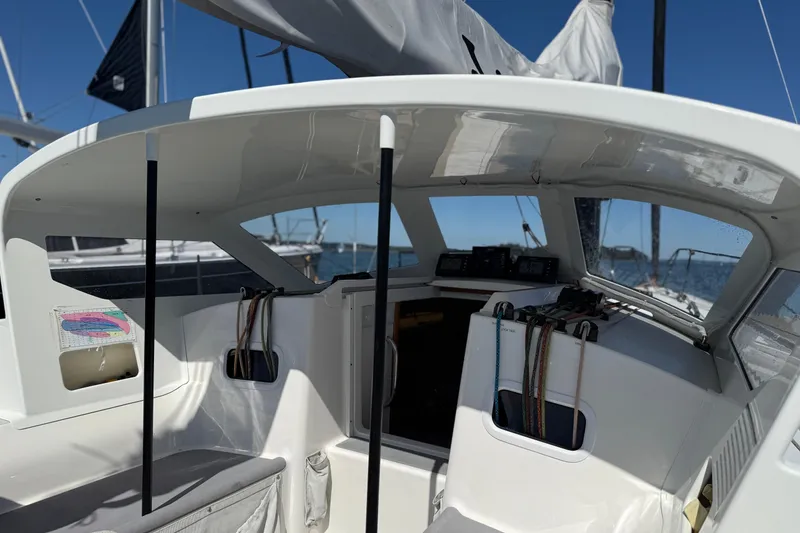 Slide: The Image of 2018 J Boats J/121 cockpit with ropes and navigation equipment under a clear blue sky. - 16