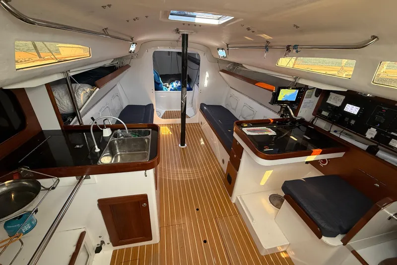 Slide: The Image of Interior of 2018 J Boats J/121 sailboat with modern navigation and kitchen area. - 18