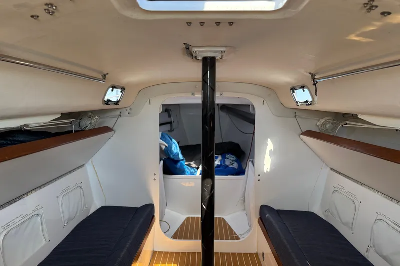 Slide: The Image of Interior of 2018 J Boats J/121 sailboat, featuring cozy seating and sleek design. - 24