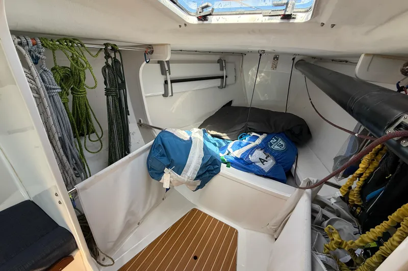 Slide: The Image of Interior of 2018 J Boats J/121 sailboat with ropes and gear storage. - 25