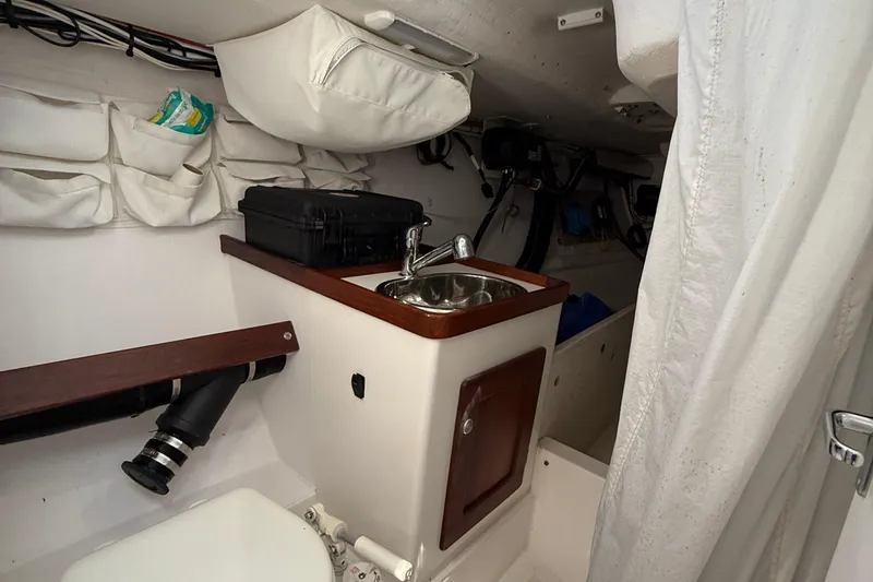 Slide: The Image of 2018 J Boats J/121 interior with sink, storage, and equipment. - 30