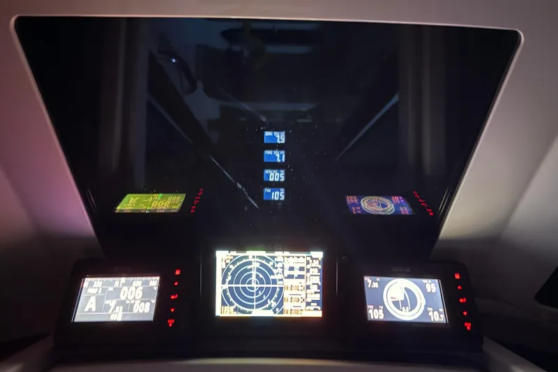 Slide: The Image of Cockpit navigation displays on 2018 J Boats J/121 yacht, showing various sailing metrics. - 36