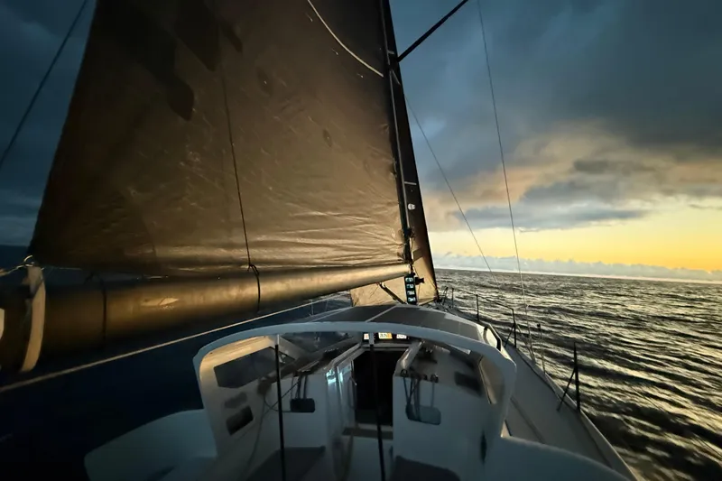 Slide: The Image of 2018 J Boats J/121 sailing at sunset on open sea. - 38