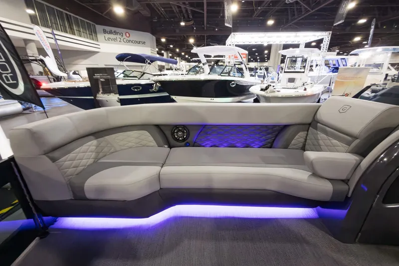 Slide: The Image of Luxurious seating on 2026 Godfrey Monaco 255 Split Bench pontoon boat with ambient lighting. - 13
