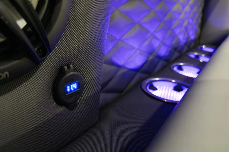 Slide: The Image of Interior of 2026 Godfrey Monaco 255 with illuminated cup holders and USB port. - 15