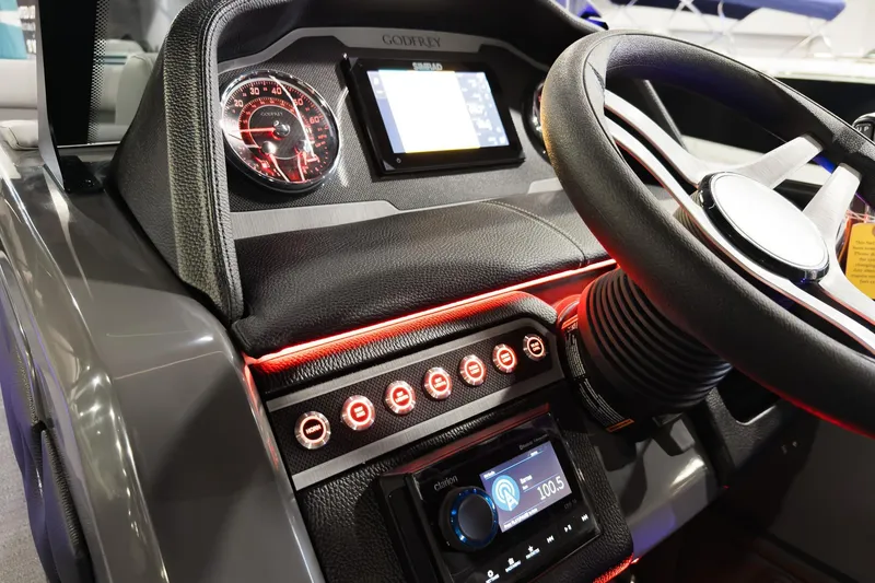 Slide: The Image of 2026 Godfrey Monaco 255 Split Bench dashboard with modern controls and steering wheel. - 21