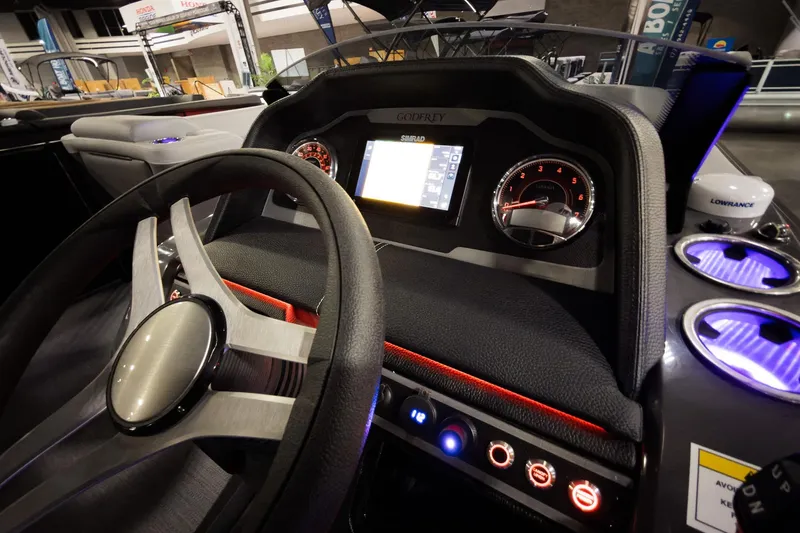 Slide: The Image of Interior dashboard of 2026 Godfrey Monaco 255 Split Bench boat with modern controls and displays. - 23