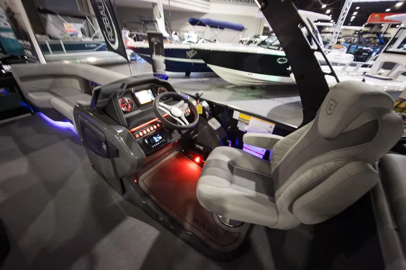 Slide: The Image of Luxurious 2026 Godfrey Monaco 255 Split Bench boat interior with modern helm and seating. - 26