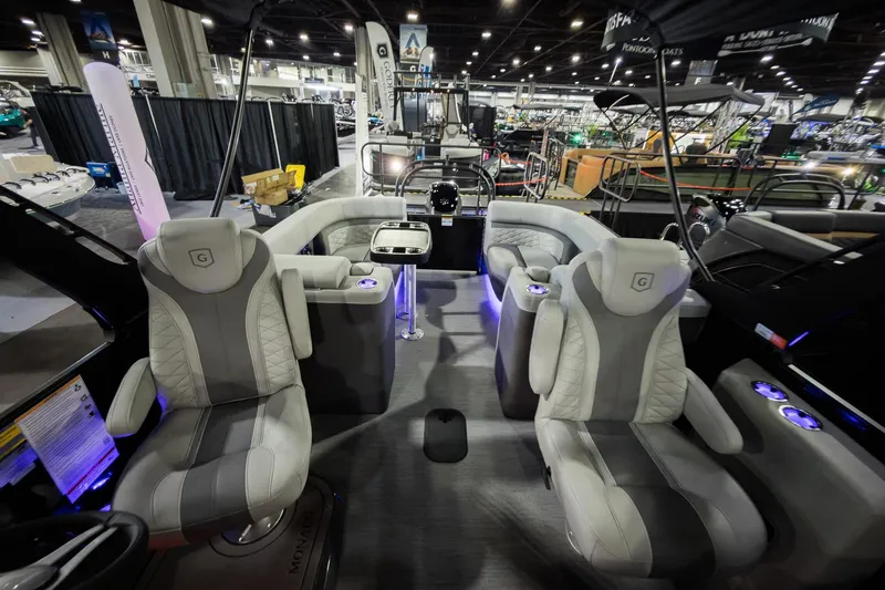 Slide: The Image of 2026 Godfrey Monaco 255 Split Bench pontoon boat interior with luxurious seating and ambient lighting. - 29