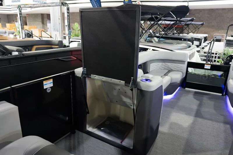 Slide: The Image of 2026 Godfrey Monaco 255 Split Bench interior with storage compartment and seating. - 32