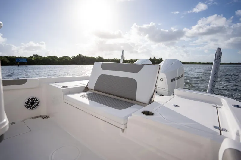 Slide: The Image of 2025 Caymas 291 boat interior with seating, on a sunny day by the water. - 7