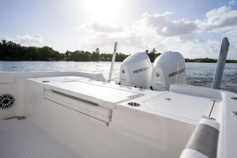 Slide: The Image of 2025 Caymas 291 boat with dual Mercury engines on a sunny day. - 8