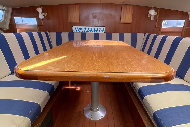 Slide: The Image of Cozy boat interior with striped seating and wooden table, Gemini Legacy 2013 model. - 14