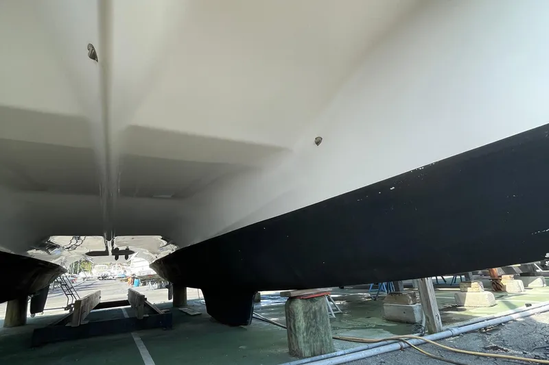 Slide: The Image of Underneath view of a 2013 Gemini Legacy catamaran on dry dock. - 5