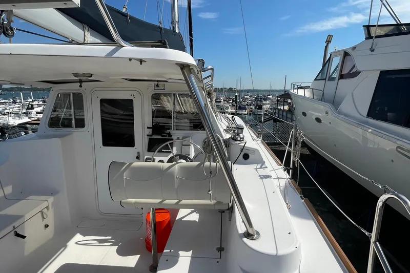 Slide: The Image of 2013 Gemini Legacy yacht docked at marina under clear blue sky. - 7