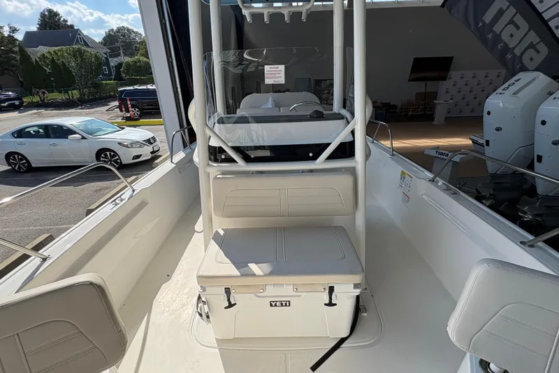 Slide: The Image of 2026 Boston Whaler 210 Montauk boat interior with Yeti cooler and seating. - 14