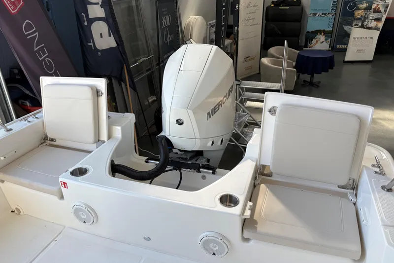 Slide: The Image of 2026 Boston Whaler 210 Montauk boat interior with Mercury engine and seating. - 5