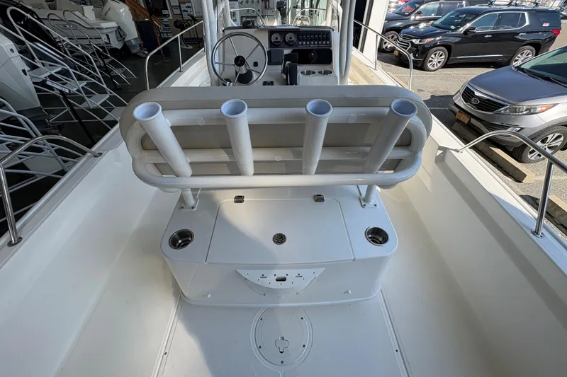 Slide: The Image of 2026 Boston Whaler 210 Montauk boat interior with rod holders and console. - 6