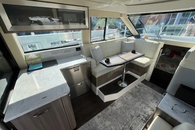 Slide: The Image of Luxurious interior of 2022 Regal 38 XO yacht with modern seating and dining area. - 20