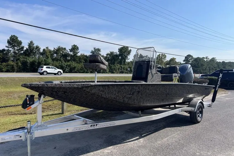 Slide: The Image of 2026 Xpress H20 boat on trailer, parked outdoors under clear sky. - 3