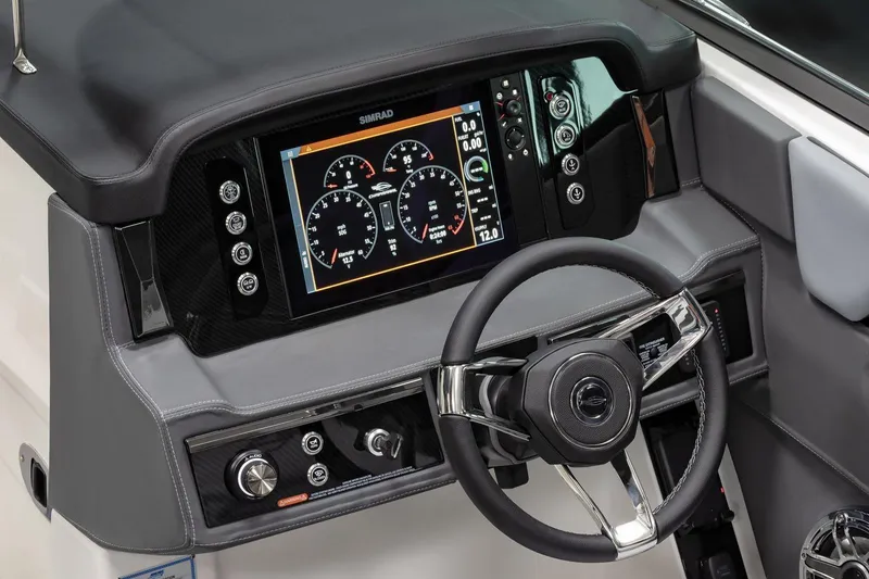 Slide: The Image of Manufacturer Provided Image: 2025 Chaparral 26 Surf dashboard with advanced digital display and sleek steering wheel. - 11