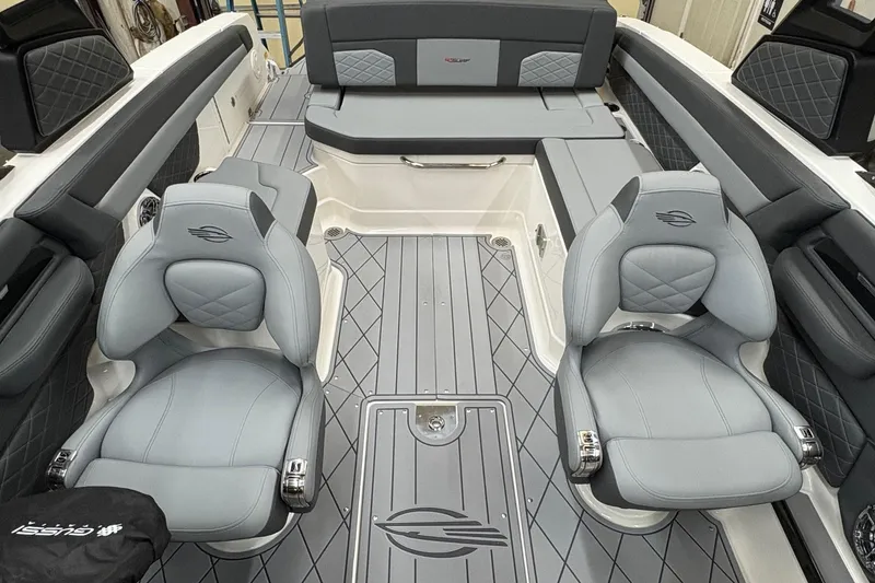 Slide: The Image of 2025 Chaparral 26 Surf boat interior with luxurious gray seating and modern design. - 5
