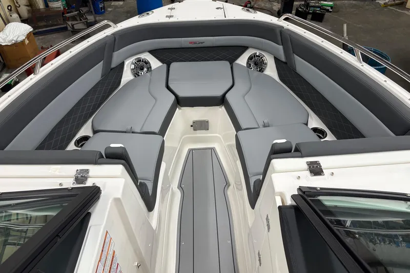 Slide: The Image of 2025 Chaparral 26 Surf boat interior with sleek gray seating and modern design. - 6