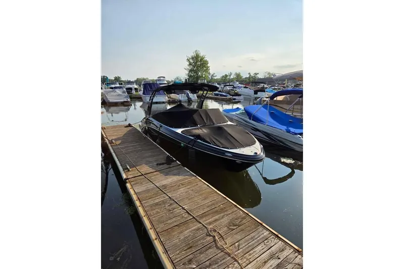 Slide: The Image of 2017 Chaparral Vortex 203 VR boat docked at marina, covered and ready for adventure. - 6