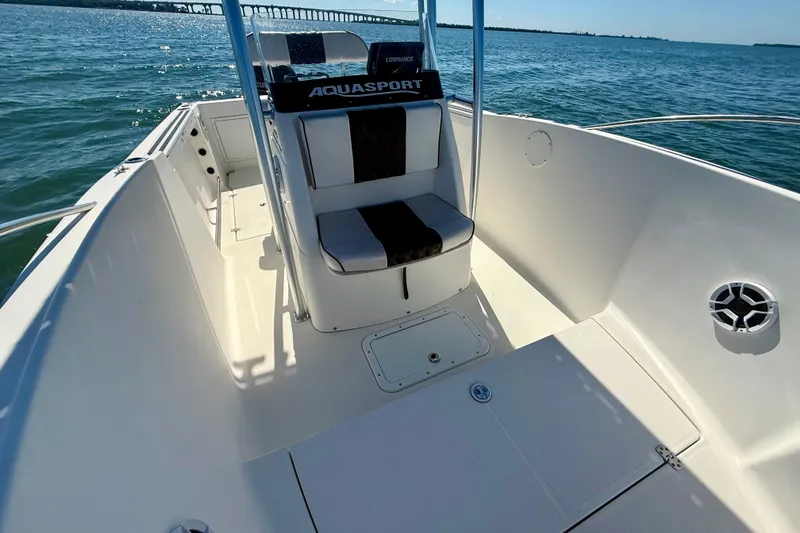 Slide: The Image of 2001 Aquasport 205 Osprey boat interior with seating, on open water. - 14