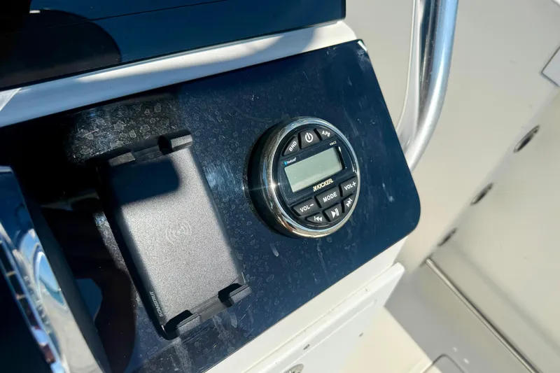 Slide: The Image of Control panel of a 2001 Aquasport 205 Osprey boat with audio system. - 22