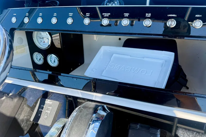 Slide: The Image of Control panel of 2001 Aquasport 205 Osprey boat with gauges and switches. - 23