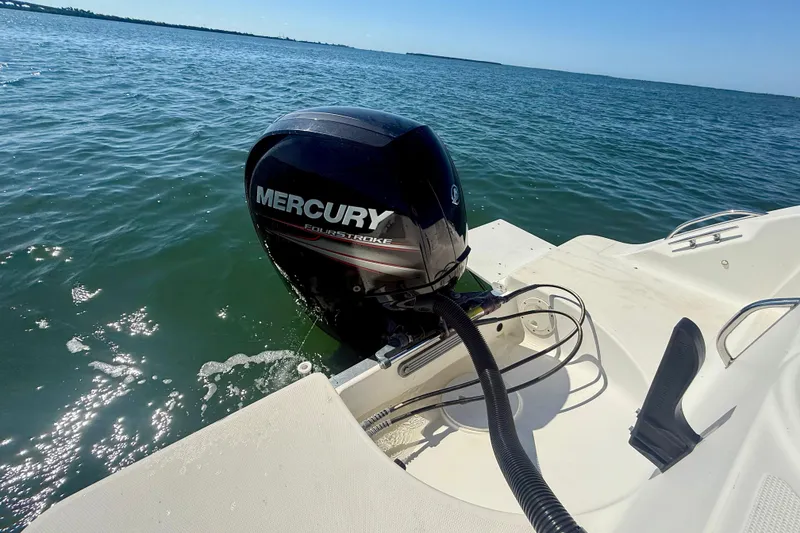 Slide: The Image of 2001 Aquasport 205 Osprey with Mercury FourStroke engine on open water. - 25