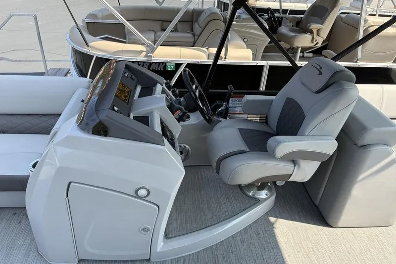 Slide: The Image of 2022 Bennington 22 LFB boat interior with captain's chair and control console. - 3