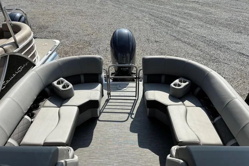 Slide: The Image of 2022 Bennington 22 LFB pontoon boat interior with gray seating and cup holders. - 5
