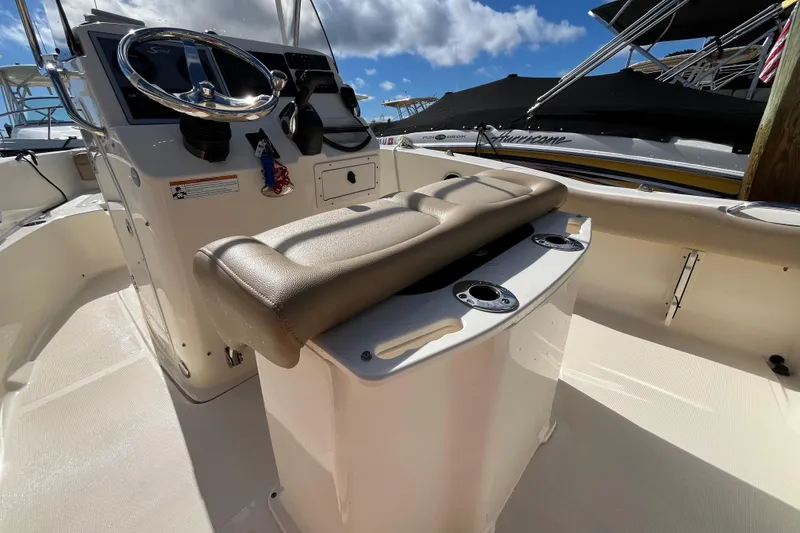 Slide: The Image of 2020 Scout 195 Sportfish boat interior with steering console and seating. - 21