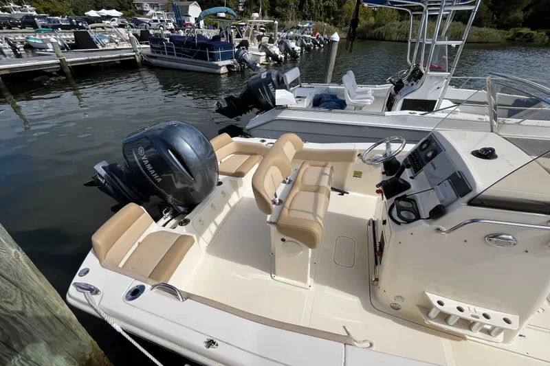 Slide: The Image of 2020 Scout 195 Sportfish boat with Yamaha engine docked at marina. - 6