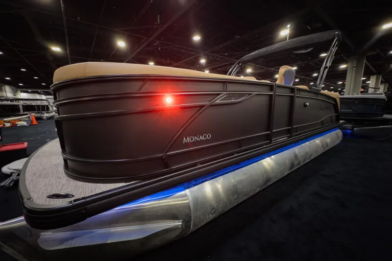 The Image of 2026 Godfrey Monaco 235 Ultra Lounge pontoon boat displayed indoors with illuminated underglow. - 0