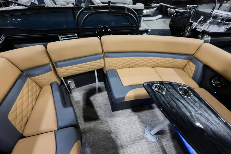 Slide: The Image of Luxurious seating area on 2026 Godfrey Monaco 235 Ultra Lounge boat with sleek table design. - 21