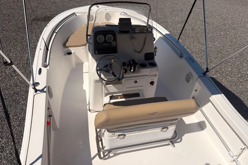 Slide: The Image of 2015 Tidewater 198 CC Adventure boat interior with steering console and seating. - 12
