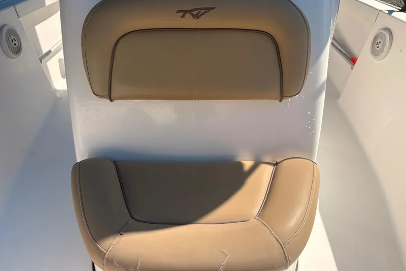Slide: The Image of 2015 Tidewater 198 CC Adventure boat seat with tan upholstery. - 18