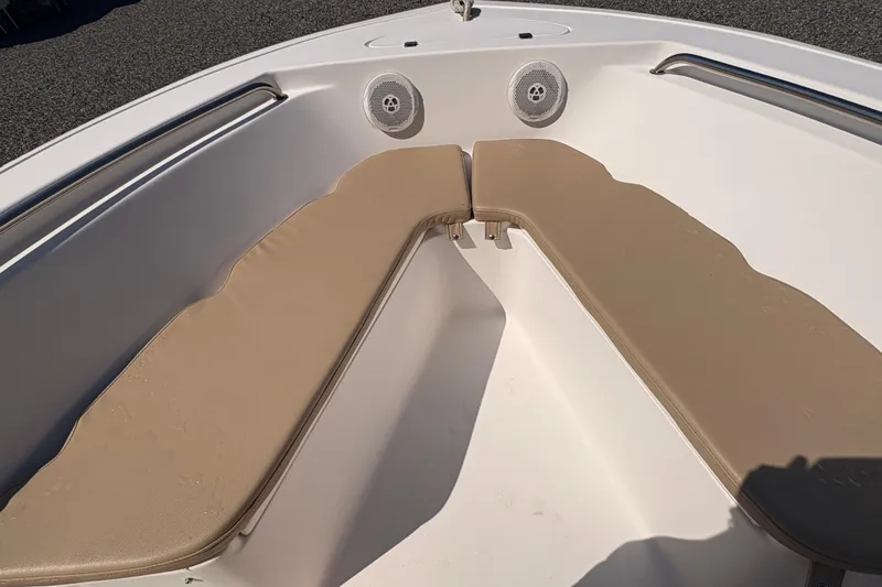 Slide: The Image of 2015 Tidewater 198 CC Adventure boat interior with beige cushioned seating. - 20