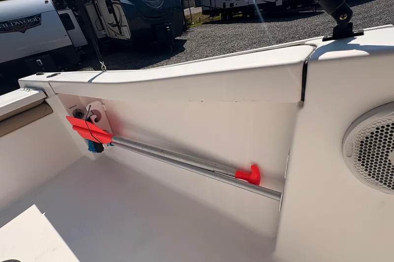 Slide: The Image of 2015 Tidewater 198 CC Adventure boat interior with mounted paddle and speaker. - 24