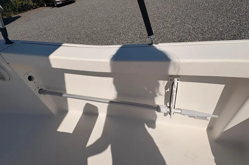 Slide: The Image of 2015 Tidewater 198 CC Adventure boat interior with shadow and rod holder. - 25