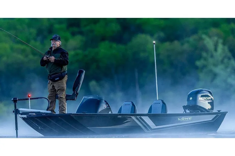 Slide: The Image of Manufacturer Provided Image: Man fishing on a 2026 Lowe Skorpion 17 boat in misty waters. - 10