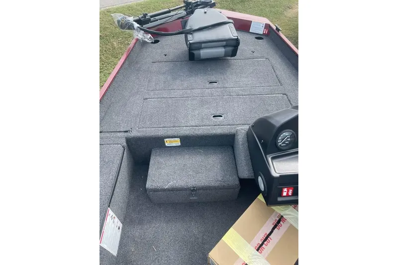 Slide: The Image of 2026 Lowe Skorpion 17 boat interior with carpeted deck and control panel. - 7