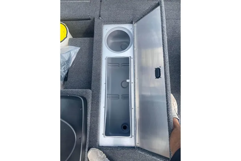 Slide: The Image of Open storage compartment in 2026 Lowe Skorpion 17 boat, featuring a spacious interior. - 9